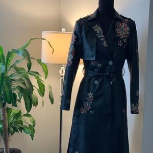 BCBG leather trench coat with floral stitching.